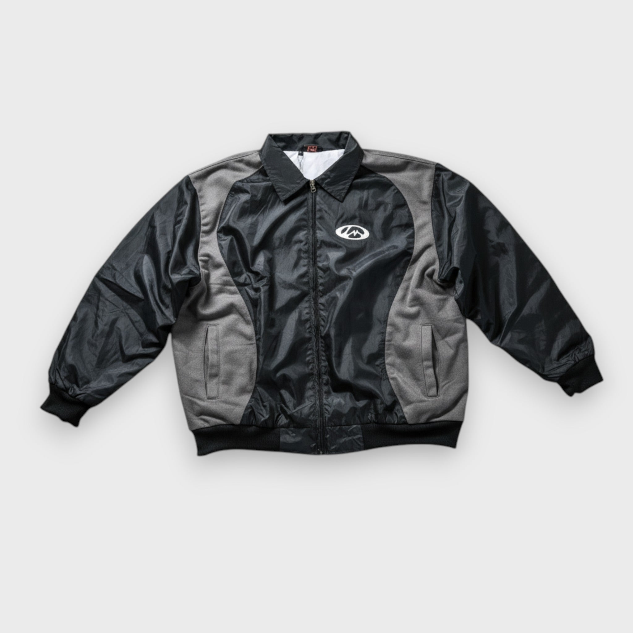 Molino black warm-up jacket front view nylon shell